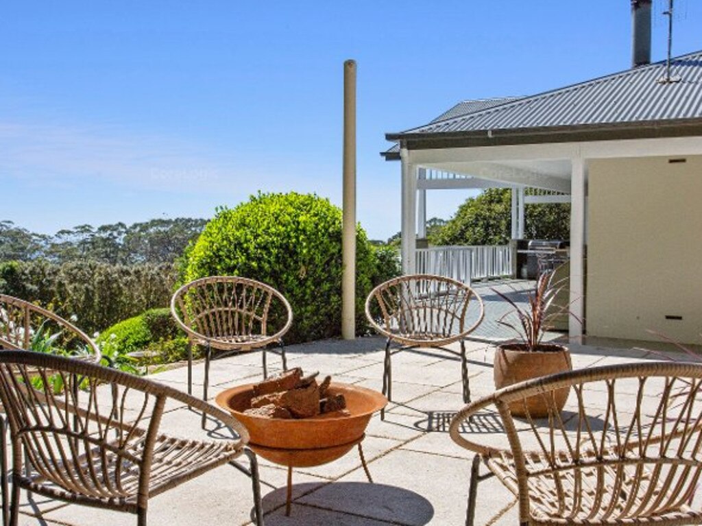 The large entertainment balcony wraps around the home.