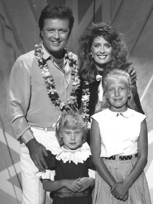 1988. TV host Johnny Young with singer Debra Byrne and her children Lauren and Arja.