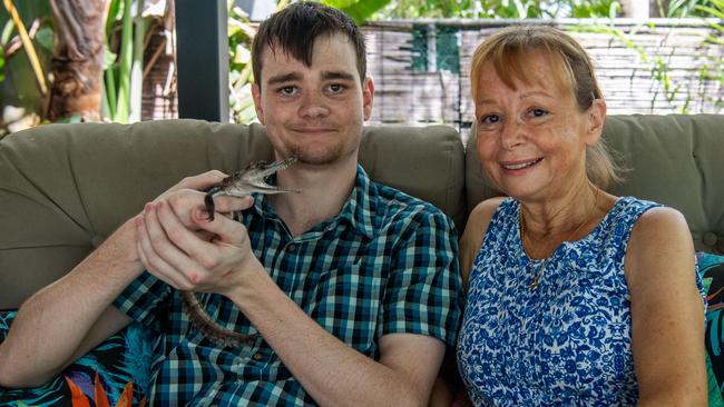 Airbnb owner Sarah Kous and son Alex with croc Brutus at their Rapid Creek home. Picture: Pema Tamang Pakhrin