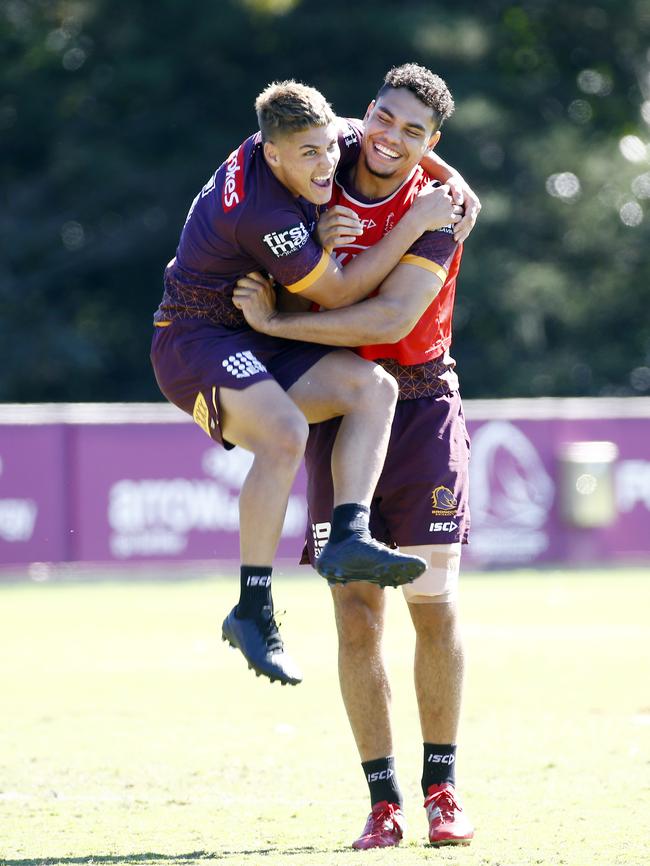 Walsh mucks around with Broncos star Xavier Coate at training. Picture: NCA NewsWire/ Tertius Pickard