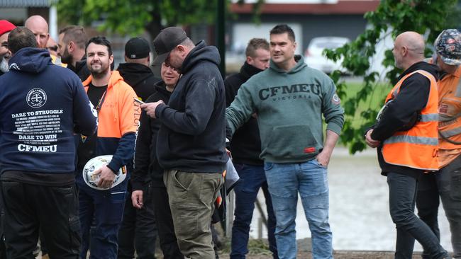 CFMEU members congregate to try to disrupt the press conference. Picture: Luis Enrique Ascui