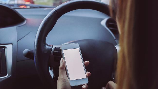 Parents illegally using mobile phones while driving their children significantly increase the risk of a crash. Picture: iStock
