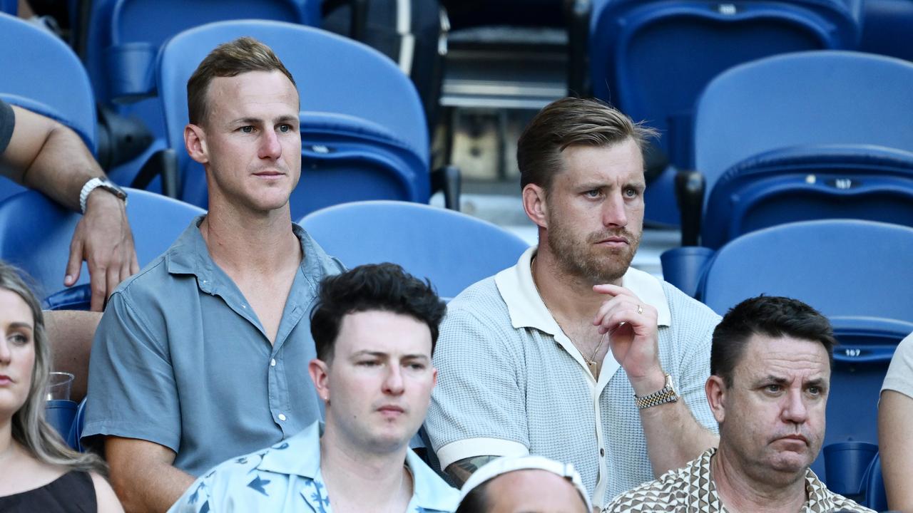 MELBOURNE, AUSTRALIA - JANUARY 18: Australian rugby players Daly Cherry-Evans and Cameron Munster watch the Men's Singles Third Round match between Jannik Sinner of Italy and Marcos Giron of the United States during day seven of the 2025 Australian Open at Melbourne Park on January 18, 2025 in Melbourne, Australia. (Photo by Quinn Rooney/Getty Images)