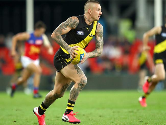 GOLD COAST, AUSTRALIA - AUGUST 04: Dustin Martin of the Tigers makes a run during the round 10 AFL match between the Richmond Tigers and the Brisbane Lions at Metricon Stadium on August 04, 2020 in Gold Coast, Australia. (Photo by Jono Searle/AFL Photos/via Getty Images)
