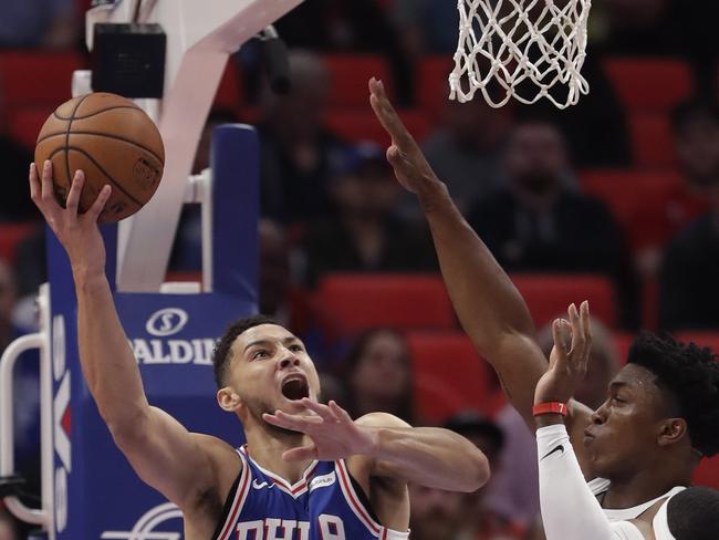 Philadelphia 76ers guard Ben Simmons (25) shoots as Detroit Pistons forward Stanley Johnson, right, defends during the first half of an NBA basketball game, Monday, Oct. 23, 2017, in Detroit. (AP Photo/Carlos Osorio)