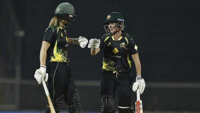 Ellyse Perry and Beth Mooney share a moment. Picture: Pankaj Nangia/Getty Images