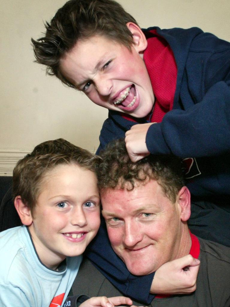 Nixon with his sons, Lewis (top) and Mitchell (left) in 2004.