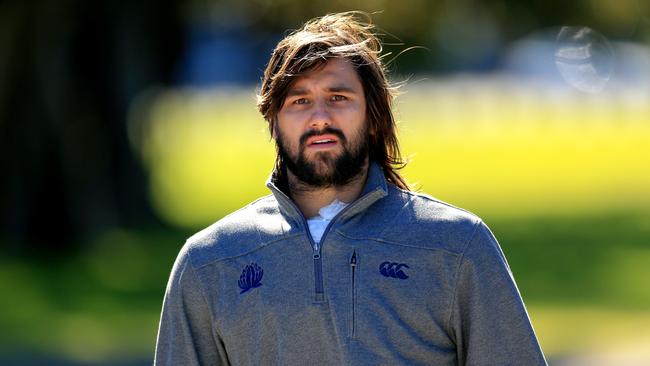 Injured Waratah Jacques Potgieter watches training at Moore Park.