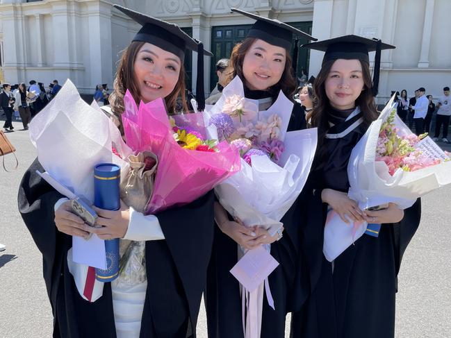 Jessica Wijaya, Andrea Chelsea and Valen Joveny Hasan graduated with a Bachelor of Commerce at the 2024 University of Melbourne graduations. Picture: Himangi Singh