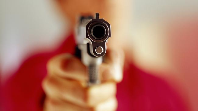 Generic image of a man aiming a gun.