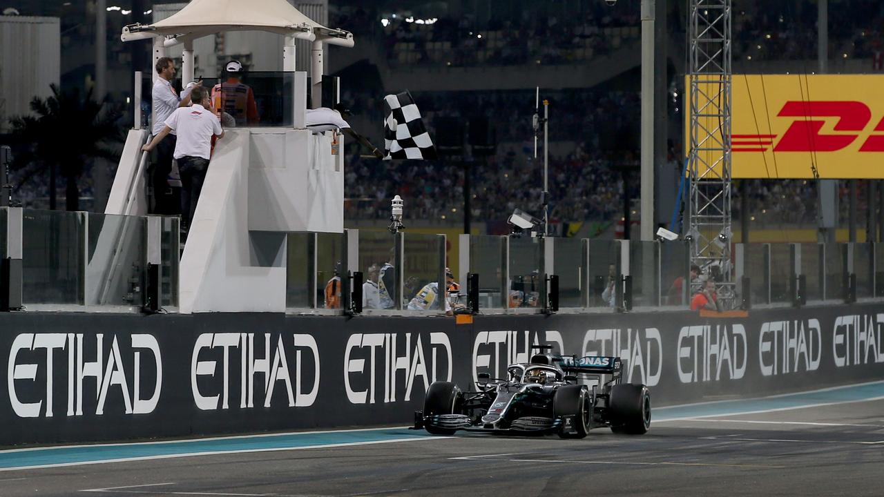 Hamilton crosses the line to win in Abu Dhabi.