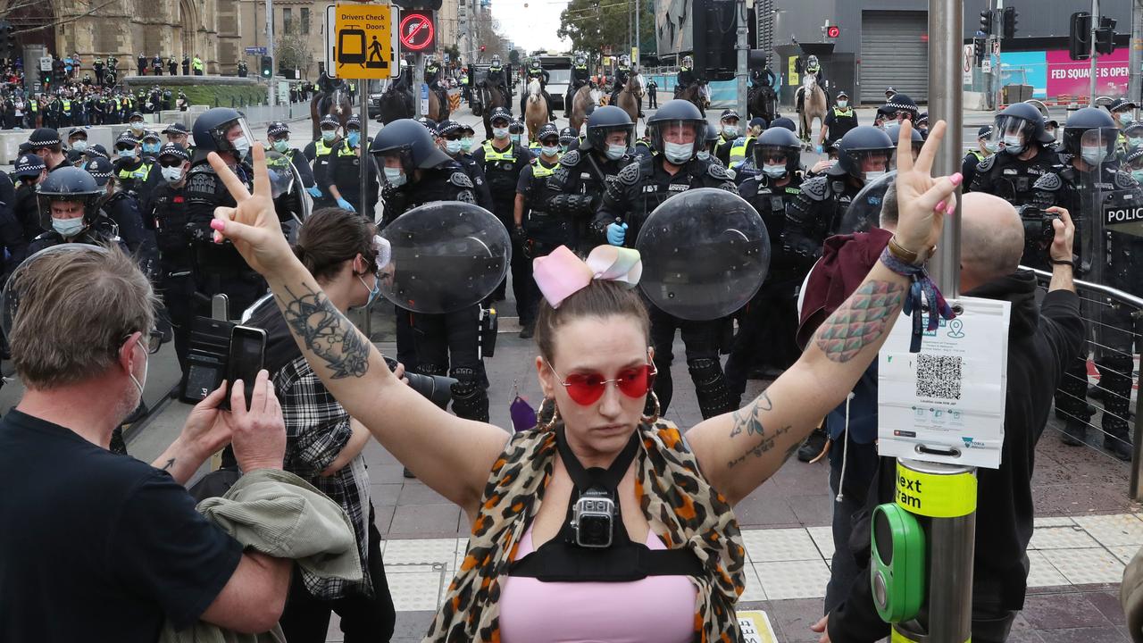 Anti lockdown protesters fought back against the hordes of police officers deployed to the rally. Picture: David Crosling