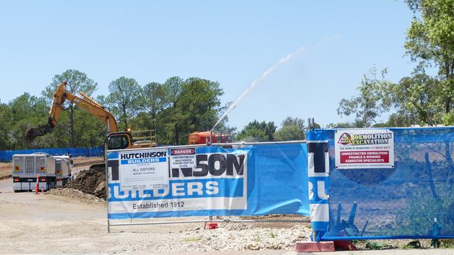 Workers load a truck with contaminated soil during the clean up of the Clarence Valley Council super depot site at South Grafton last month.