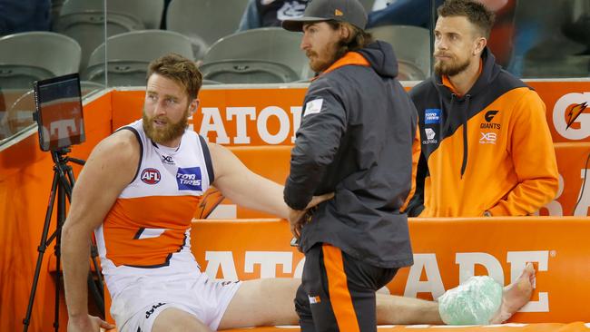 Injured Giants Dawson Simpson and Brett Deledio sit on the bench.