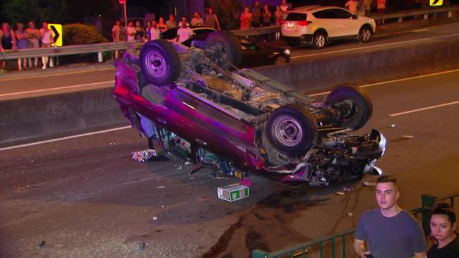The two women died after their Honda Sedan was hit by a Toyota LandCruiser and flipped onto its roof on Henry Lawson Dr in Peakhurst just before 8pm. Photo: Active Media Images