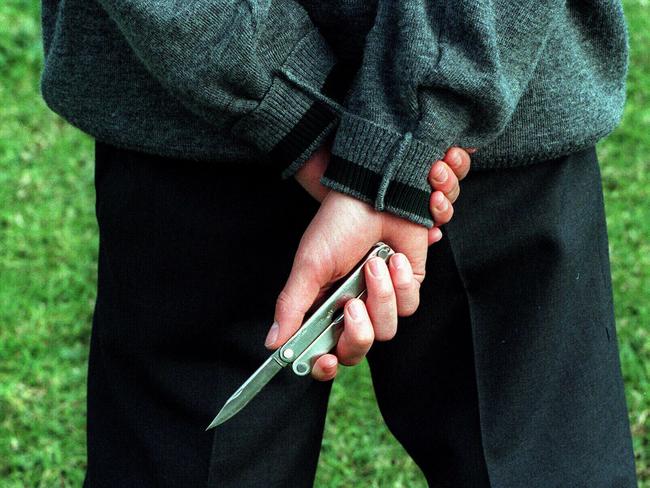 Gang member and student from Sarah Redfern High at Minto carries a knife to school. NSW / Education / Teenagers / Gangs / Knives weapons protection youth crime violence juvenile generic