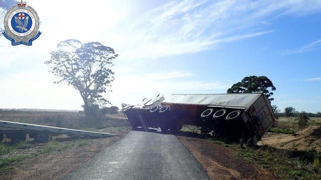 The rolled truck which led police to Adams. Picture: NSW Police