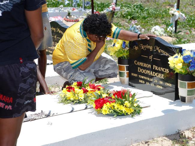 Palm Island cemetery on the fifth anniversary of the death in custody of Cameron (Mulrunji) Doomadgee. Mulrunji's sister Valmae Aplin lays a wreath at his resting place.