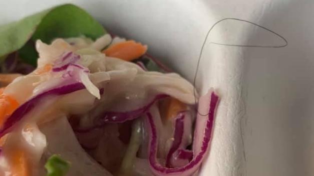 A human hair on top a salad served by a top Brisbane hotel to quarantine guests. Picture: Supplied