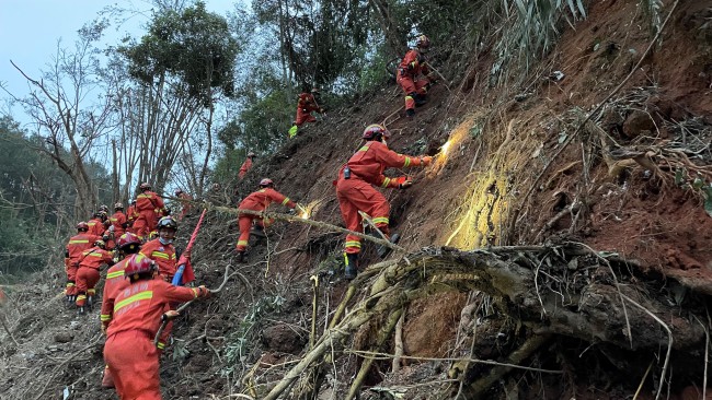 Rescuers searching for the black boxes at the crash site in Tengxian County, south China's Guangxi Zhuang Autonomous Region, March 22, 2022.  (Photo by Zhou Hua/Xinhua via Getty Images)