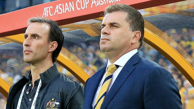 Ange Postecoglou, r, Coach of Australia, during the National Anthems at the Socceroos v Oman Asian Cup game at ANZ Stadium, Sydney Olympic Park. pic Mark Evans