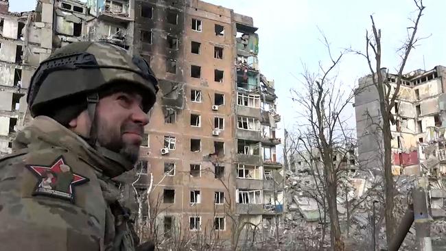 Denis Pushilin, the Moscow-appointed head of the Donetsk region of Ukraine, walking past destroyed residential buildings in Avdiivka, in Russian-controlled Ukraine. Picture: Handout / Telegram / @pushilindenis / AFP