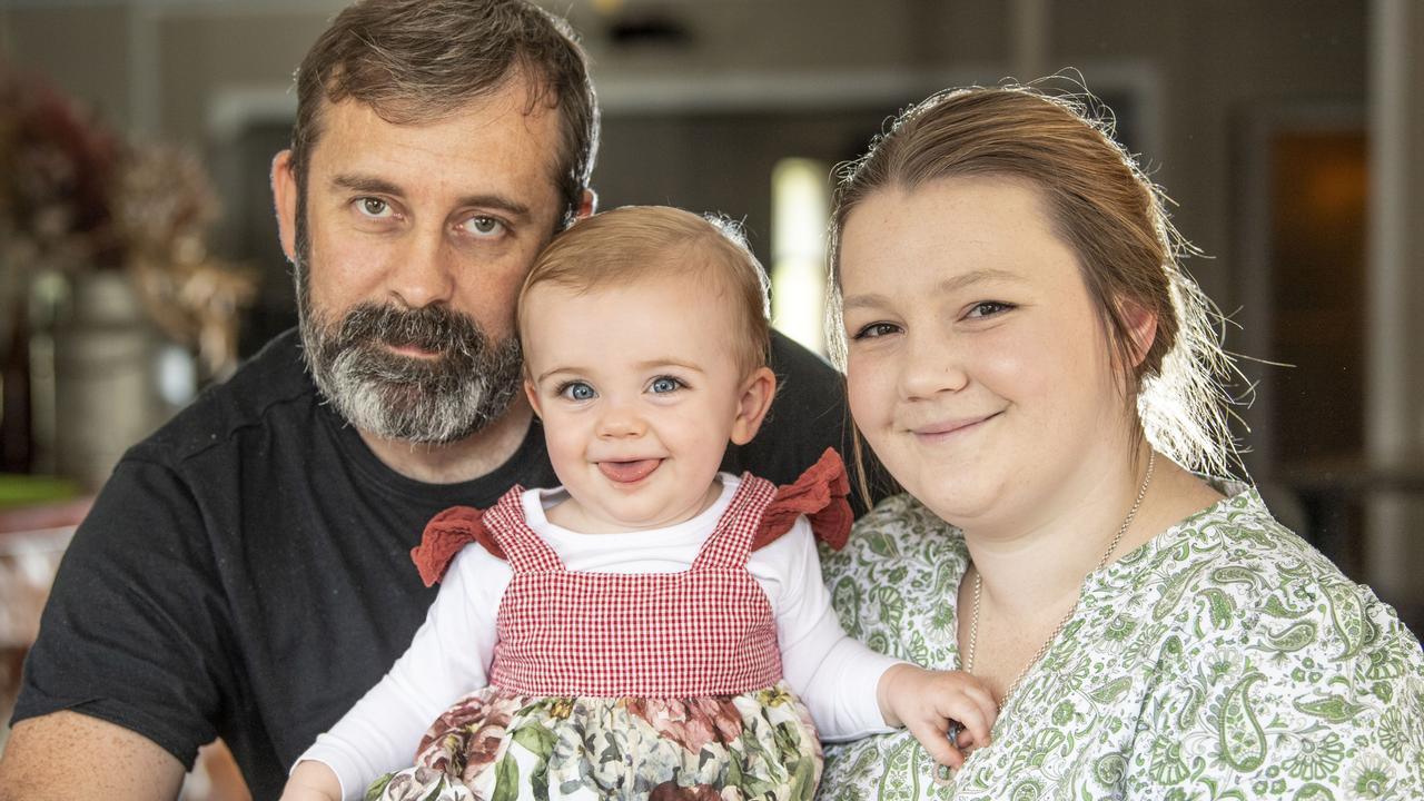 14 month old Olivia Luck with parents Nick Luck and Caity Jones. Thursday, March 17, 2022. Picture: Nev Madsen.