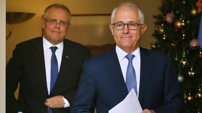 Scott Morrison, left, and Malcolm Turnbull announce a backflip yesterday to approve a banking and financial services royal commission. Picture: Kym Smith