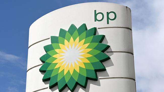 (FILES) In this file photo taken on May 12, 2021 BP logos are pictured at a BP petrol and diesel filling station in north London - BP returned to profit in 2021 as oil and gas prices surged following a huge loss the prior year when the pandemic struck, the British energy giant revealed on February 8, 2022. BP posted a net profit of $7.6 billion (6.7 billion euros) last year, compared with a loss after tax of $20.3 billion in 2020, the company said in a statement. (Photo by Glyn KIRK / AFP)