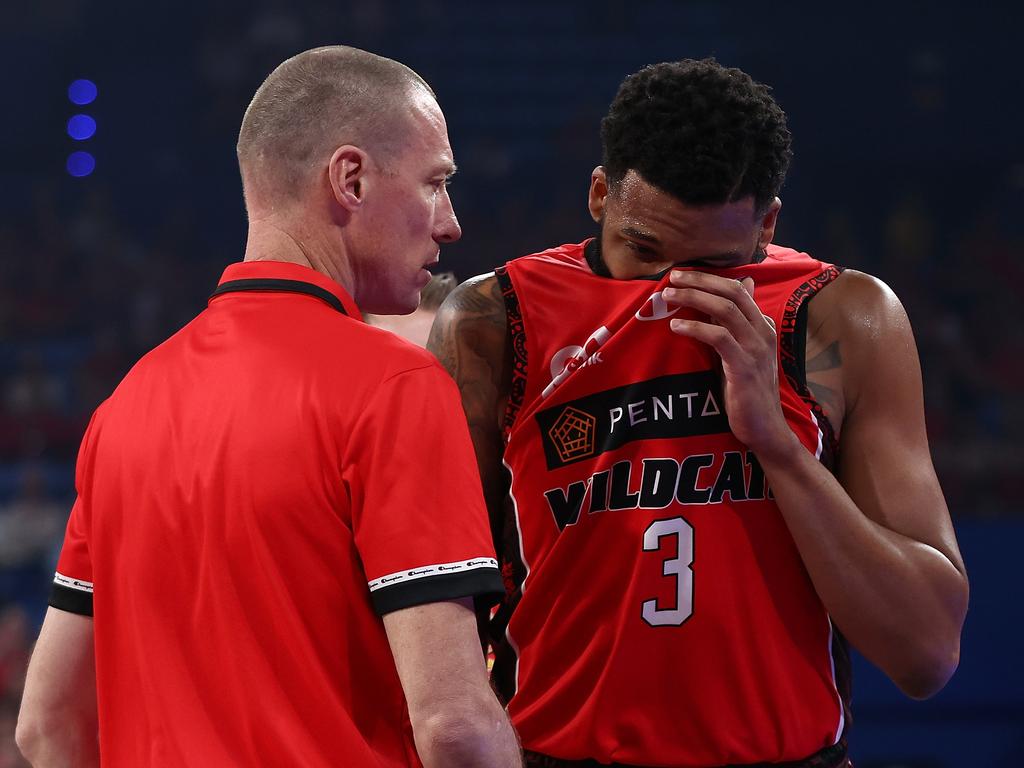 TaShawn Thomas of the Wildcats walk from the court with an injury in the first quarter of Perth’s win over Illawarra. Picture: Paul Kane/Getty Images