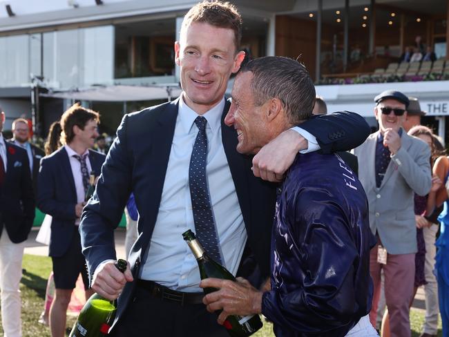 Oliver is congratulated by Mark Zahra. Picture: Michael Klein