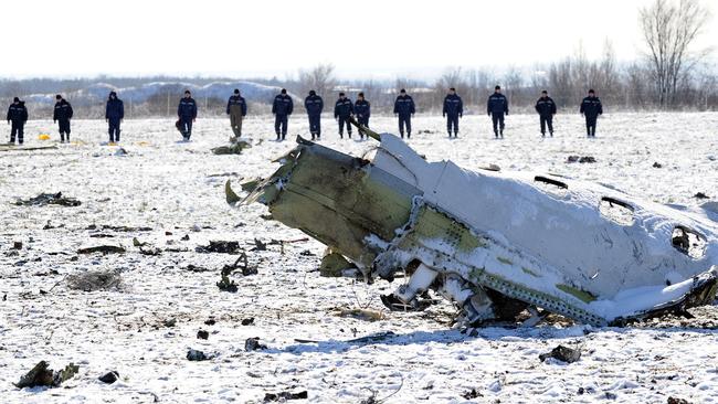 Russian emergency crews search the wreckage of the plane, which crashed as it attempted to land at the Rostov-on-Don airport in bad weather on Saturday. Picture: AFP/STR