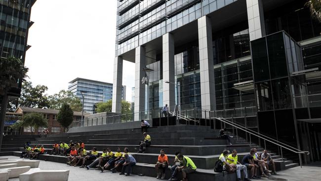 Tradies taking a break at the Smith St end of the new Parramatta Square development. Picture: Darren Leigh Roberts