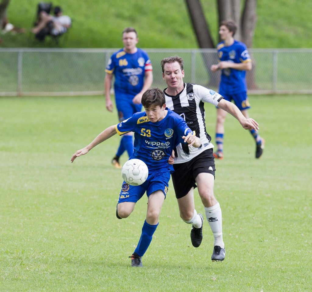 Calum Proctor, USQ and Trent Donovan, Willowburn. Football, Willowburn vs USQ. Sunday, 4th Mar, 2018. Picture: Nev Madsen