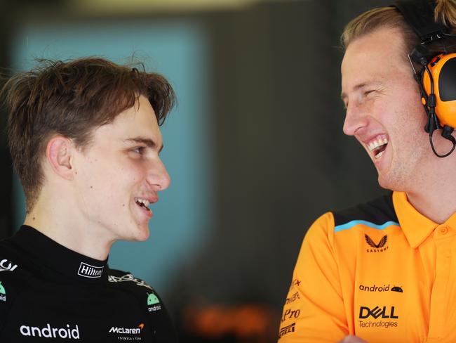 BAHRAIN, BAHRAIN - FEBRUARY 25: Oscar Piastri of Australia and McLaren talks with a McLaren team member in the garage during day three of F1 Testing at Bahrain International Circuit on February 25, 2023 in Bahrain, Bahrain. (Photo by Peter Fox/Getty Images)