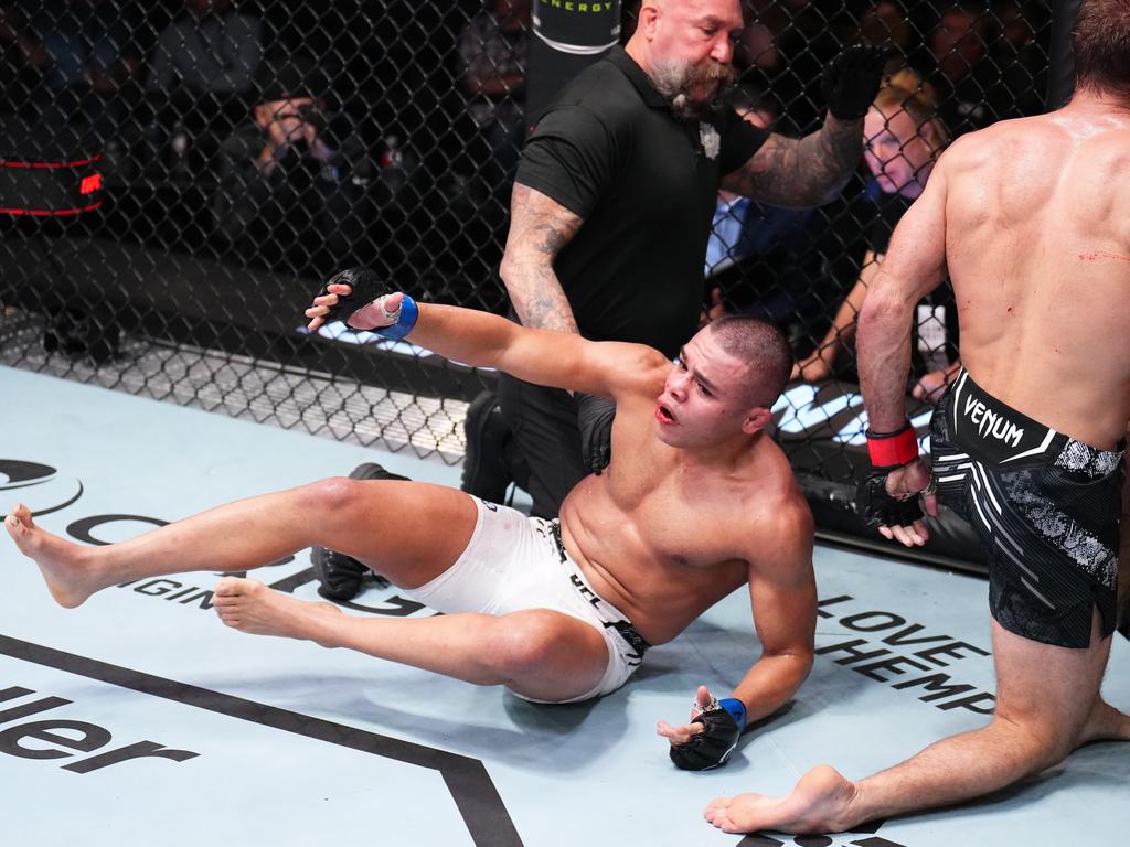 Nikolas Motta (centre) reacts to his bizarre no contest against Trey Ogden in November. Picture: Chris Unger/Zuffa LLC via Getty Images