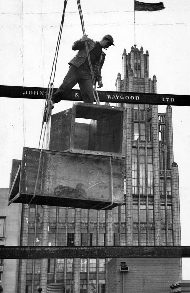 One false move and it's a long way down. There was no such thing as OHS on building sites in 1954. Picture: The Argus.