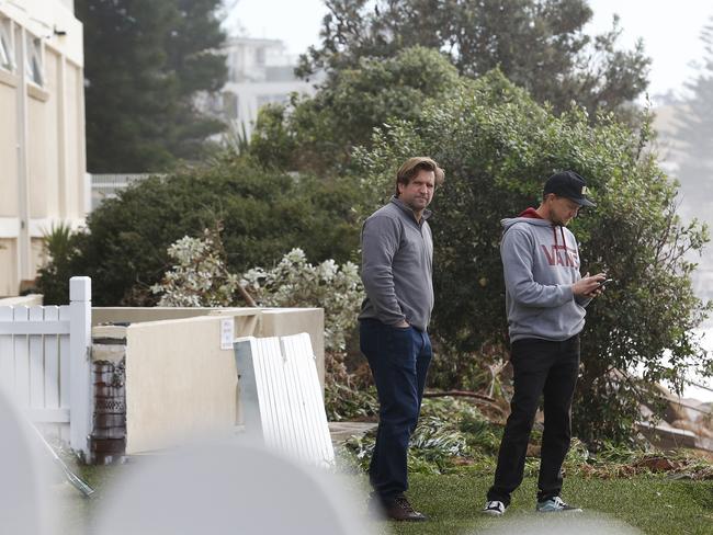 Des Hasler, former Manly coach now at the Bulldogs, surveys the damage to his Collaroy home. Picture: AAP