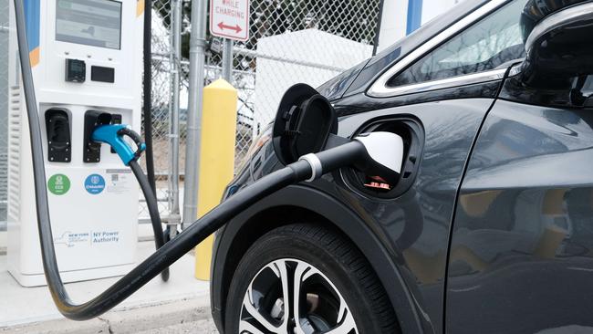 A driver uses a fast-charging station for electric Picture: Spencer Platt/Getty Images/AFP