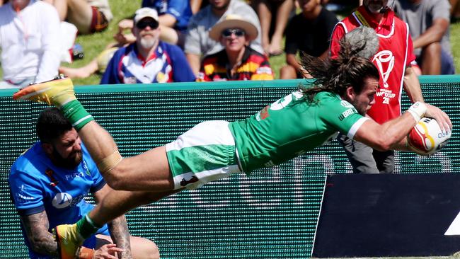 Liam Kay dives for the tryline in Ireland’s win over Italy.