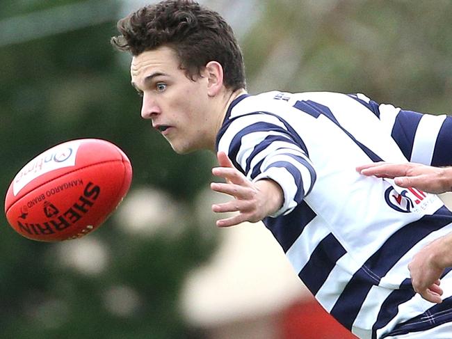 Zach Smedley of Macedon (left) under pressure from Matthew Medcraft of Diggers Rest during RDFL footy: Diggers Rest v Macedon on Saturday, May 12, 2018, in Diggers Rests, Victoria, Australia. Picture: Hamish Blair