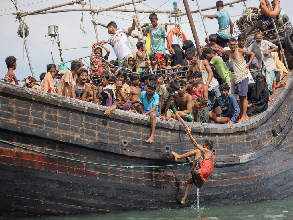 Boatload Of Rohingya Refugees In Aceh Beach Standoff. Nearly 600 Have ...