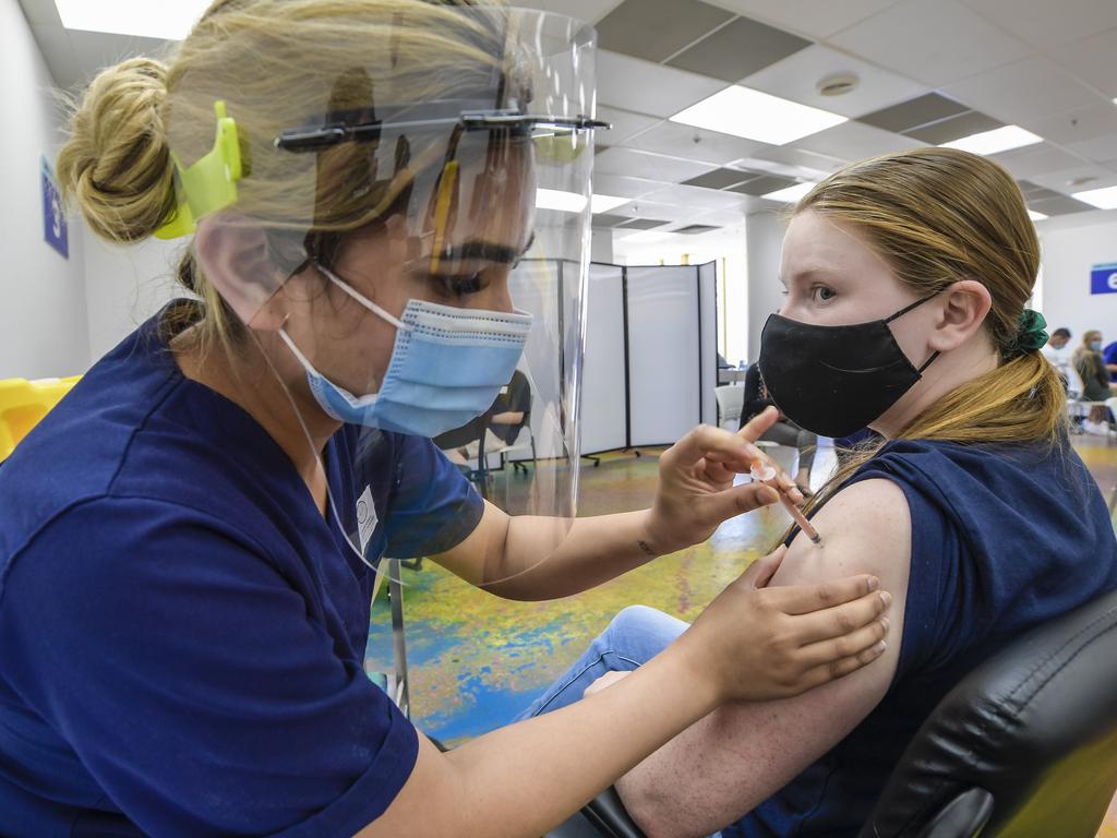 Nurse Navpreet Mahal gives Jessica Penfold her booster vaccine. Picture: Roy VanDerVegt