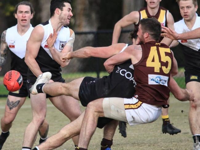 Trent Farmer suffered a broken arm in this tackle. Picture: Davis Harrigan