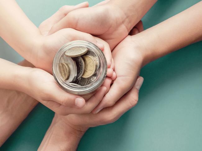 child and parent hands holding money jar, donation, saving, charity, family finance plan concept, Coronavirus economic stimulus rescue package, superannuation conceptImage for GT What's On page