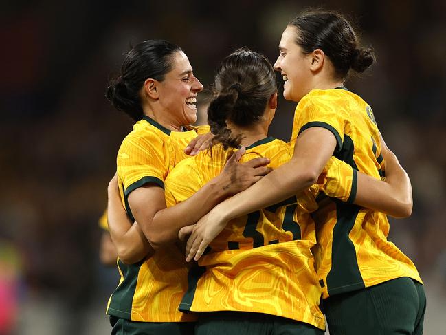 MELBOURNE, AUSTRALIA - DECEMBER 04: Bryleeh Henry of Australia celebrates with team mates after scoring a goal during the International Friendly match between Australia Matildas and Chinese Taipei at AAMI Park on December 04, 2024 in Melbourne, Australia. (Photo by Daniel Pockett/Getty Images)