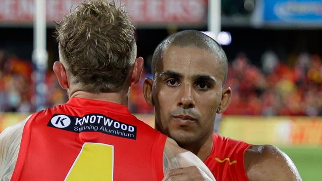 GOLD COAST, AUSTRALIA - MARCH 09: Touk Miller and Brandon Ellis of the Suns celebrate after the 2024 AFL Opening Round match between the Gold Coast SUNS and the Richmond Tigers at People First Stadium on March 09, 2024 in Gold Coast, Australia. (Photo by Russell Freeman/AFL Photos via Getty Images)