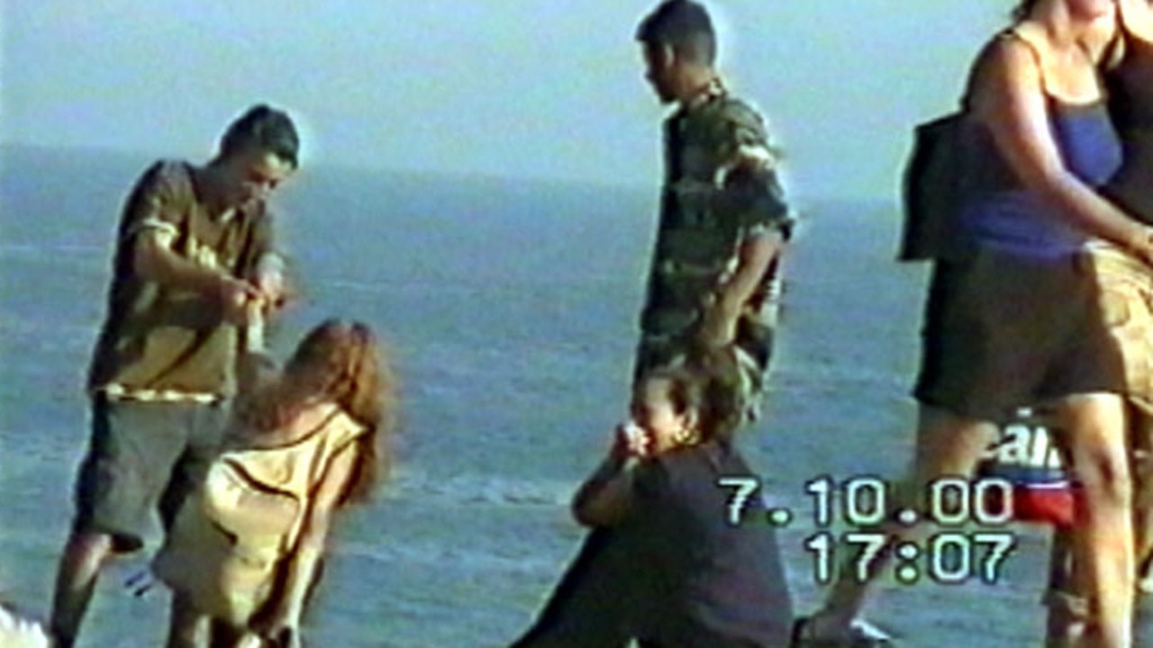 Police surveillance pics of gang rapist Mohammed Skaf (brown T-shirt) at Bondi Beach on October 7, 2000 prior to his arrest.