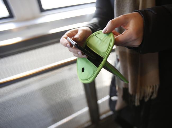 The boys’ phones will be put in the Yondr pouch before school starts. Picture: Wall Street Journal