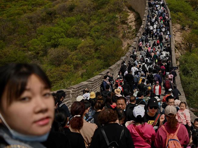 TOPSHOT - People visit the Great Wall during the labour day holiday in Beijing on May 1, 2021. (Photo by Noel Celis / AFP)